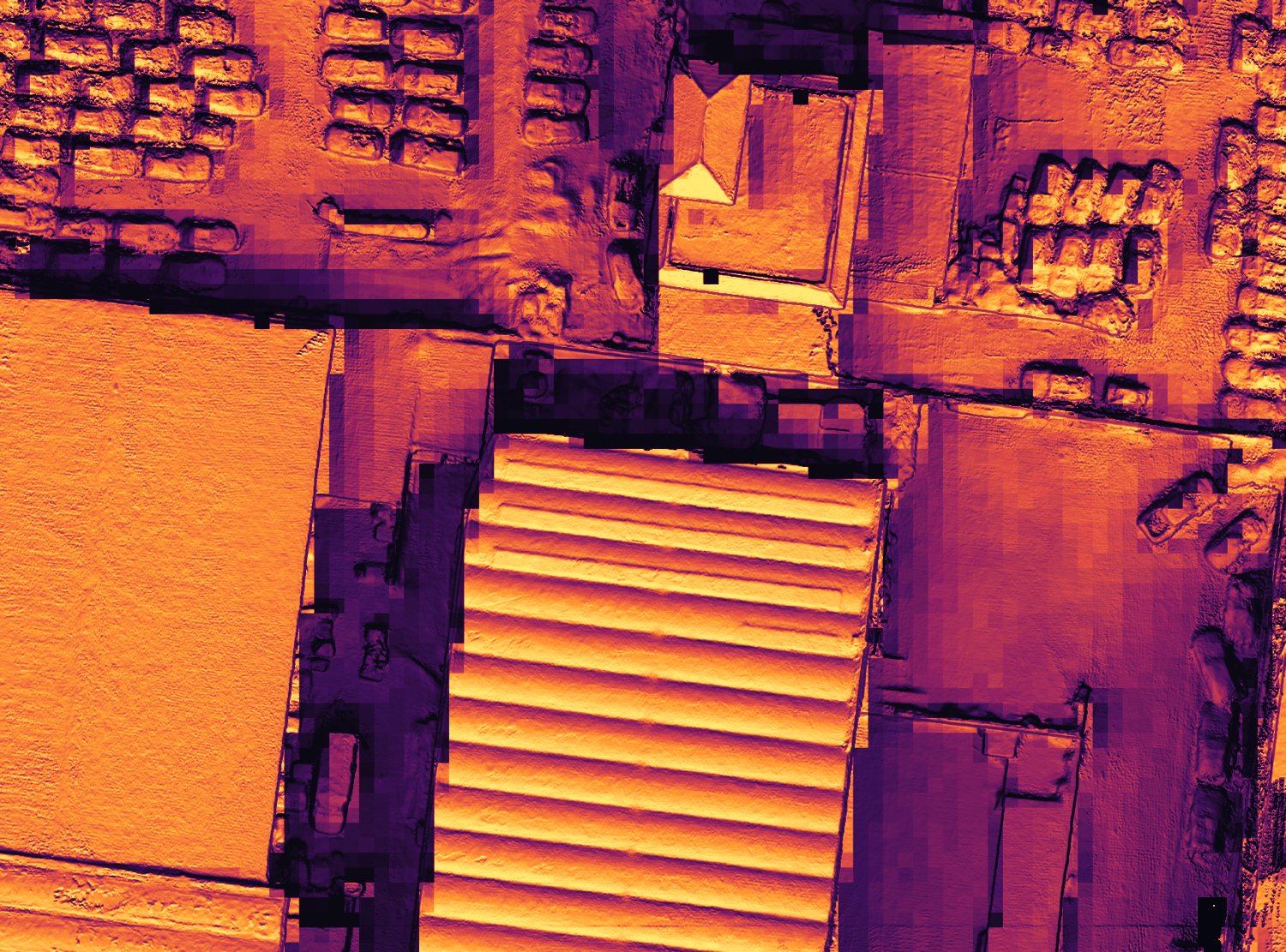 Industrial roof from above with the best-exposed surfaces standing out from the shaded ones